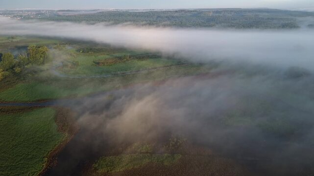 Atmospheric aerial cinematic view of epic foggy nature scener