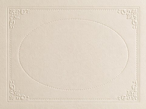Ivory embossed paper frame with oval panel and floral corners