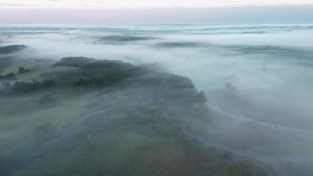 Atmospheric aerial cinematic view of epic foggy nature scener
