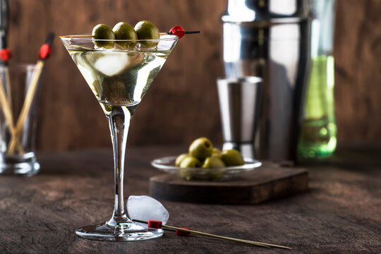 Classic Martini Glass with Clear Alcohol Cocktail and Green Olives
