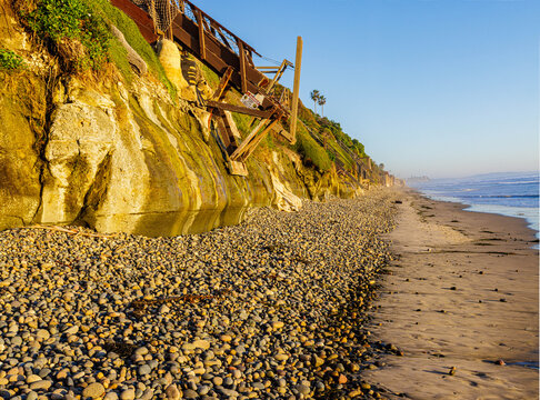Wooden Stairs on The Rocky Shoreline Below The Bluffs of  Grandview Surf Beach, Encinitas, California, USA