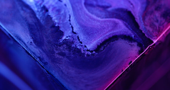 Paint mix. Neon flow. Defocused blue purple color light texture shiny blend fluid spilling on abstract art background.