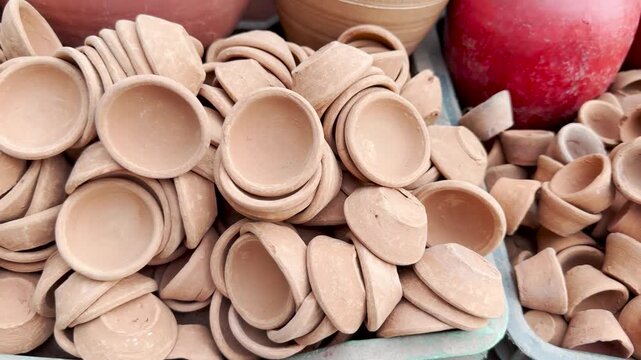 Handmade earthen clay pottery cups for sale diwali diya celebration festival 4k video footage