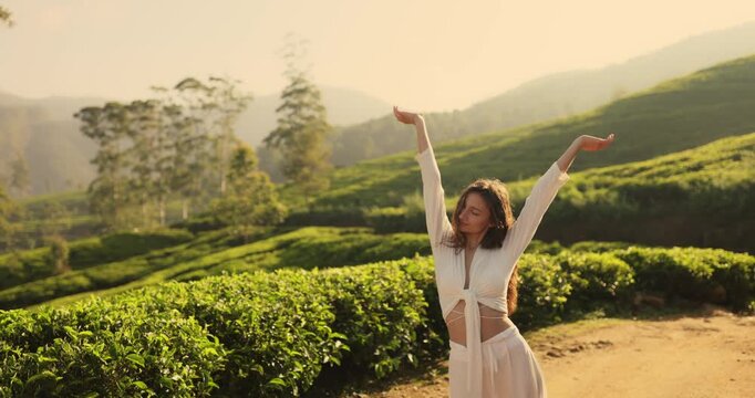 Joyful Woman in Tea Fields of Nuwara Eliya, Sri Lanka