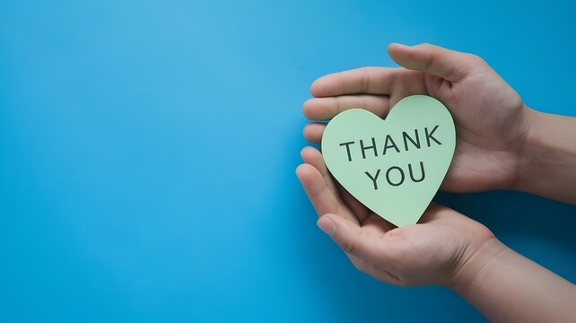Hands holding heart shaped paper with thank you message on blue background, gratitude appreciation kindness support thankful concept, heartfelt care and recognition gesture