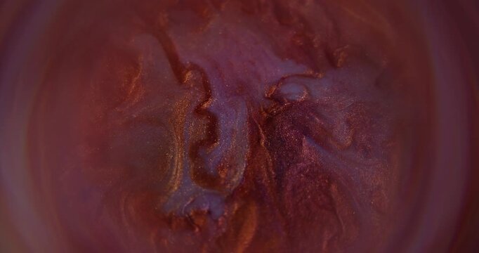 Defocused dye splash. Color water pigment. Orange purple round paint bright fluid glitter liquid art rainbow floating on abstract background.