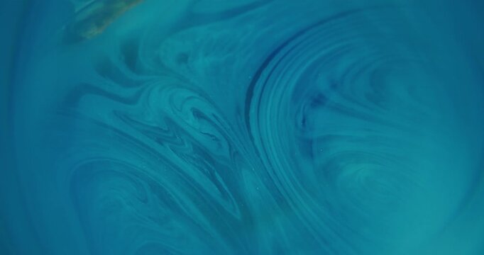 Defocused twirl paint. Marble pigment. Blue color shimmer acrylic art water glitter round texture liquid swirl on abstract background.