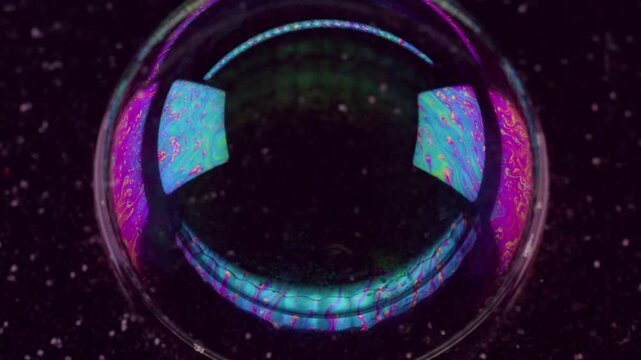 Round tunnel. Oil pigment. Circle futuristic lens frame on defocused grain black background. Abstract floating gasoline ink blend fluid.