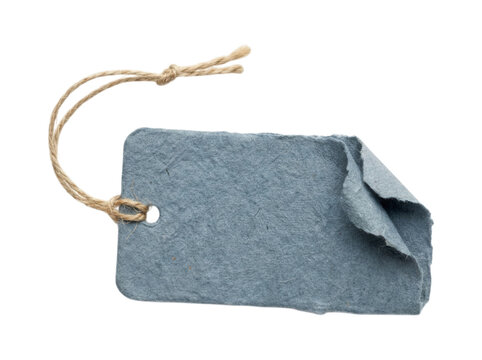 Rustic blue handmade paper gift tag with frayed edges and natural twine string isolated on transparent background for luxury branding