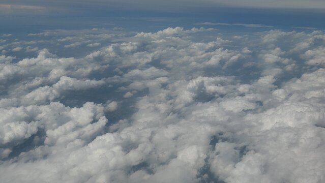 Aerial View of White Clouds from Airplane