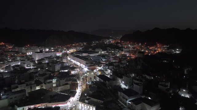 Aerial Night View of Mutrah Corniche Muscat Oman Waterfront and City Lights