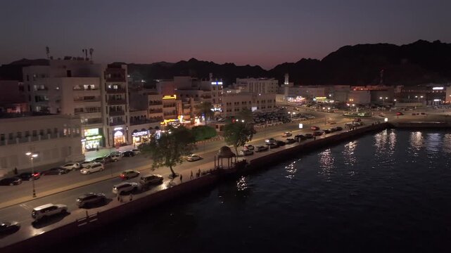 Aerial Night View of Mutrah Corniche Muscat Oman Waterfront and City Lights