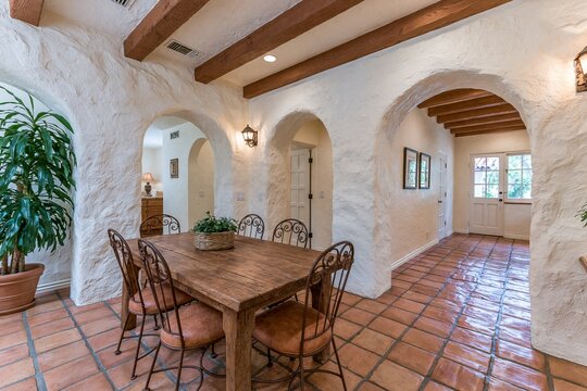 rustic dining table with chairs in adobe style