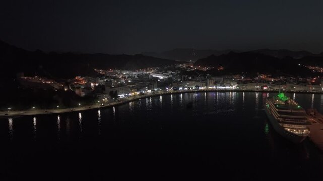 Aerial Night View of Mutrah Corniche Muscat Oman Waterfront and City Lights