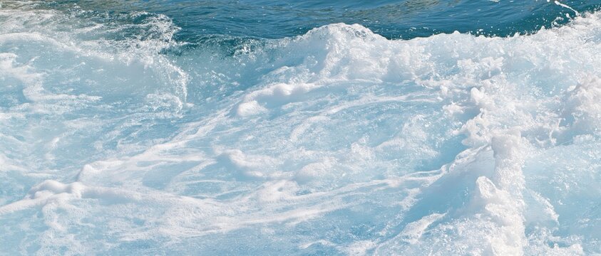 Foamy ocean wave with fine bubbles and aeration in close range