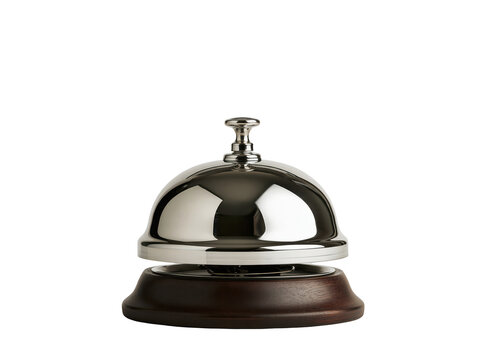 Shiny metal hotel service bell with a wooden base isolated on a white background