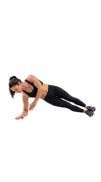 Athletic woman performing side plank exercise on white background, fitness model in black sportswear doing core workout, strength training and pilates