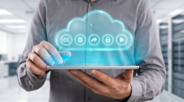 Male hands holding premium tablet with glowing cyan serverless computing hologram showing cloud and function icons on bright background for modern cloud architecture and scalable technology concept