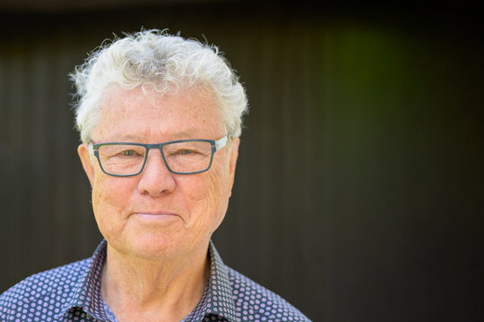Confident Senior Man Wearing Glasses