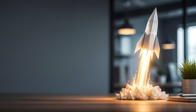 Glowing paper rocket taking off from wooden desk symbolizing startup launch and venture business growth