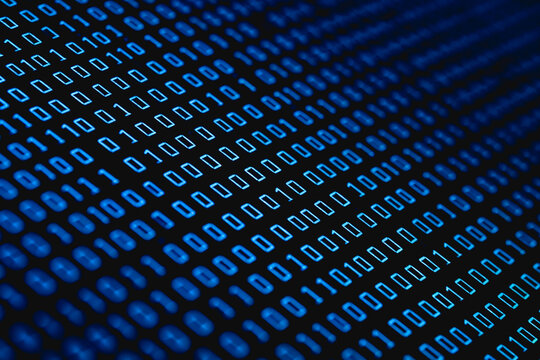 A close-up view of glowing blue binary code arranged in dense rows, representing digital data and technology.