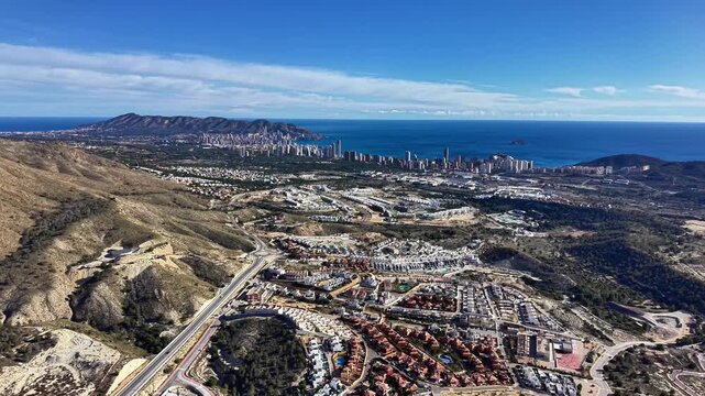 Aerial City Skyline Along Turquoise Sea, Highrise Cluster On Coastline, Marina And Bay Visible, Urban Grid