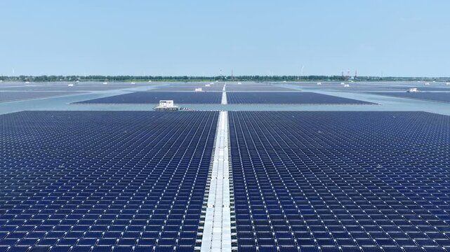 expansive floating solar panel array on blue water surface