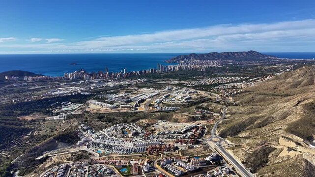 Aerial Coastline View With City Sunlit Panorama Showing Shoreline Highrises, Marina, Sprawling Suburbs