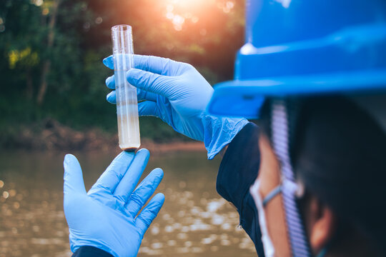 Environmental officials performing water sampling to identify chemical abnormalities and potential pollution.