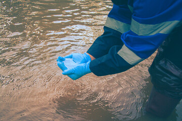 Water quality assessment through field sampling and laboratory analysis by environmental officials.