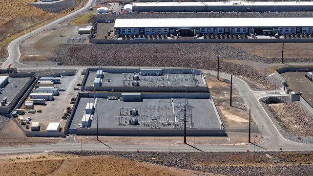 Aerial view of electrical substations powering industrial park