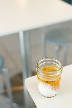 Glass of milk latte coffee on a table.