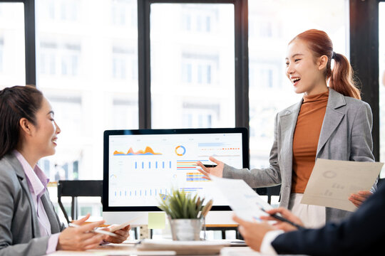 Asian Businesswoman Presenting Financial Growth Report in Office Meeting