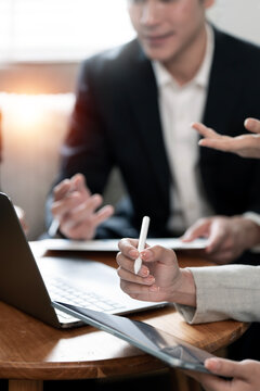 Businessman Explaining Financial Strategy During Meeting with Colleague