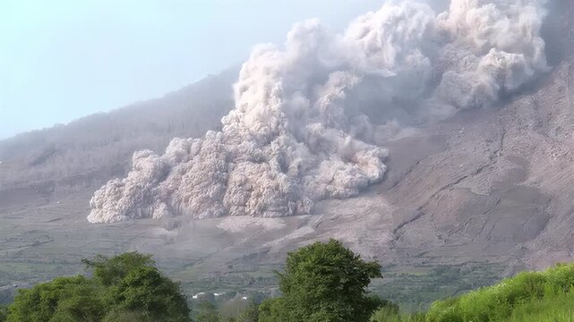Massive volcanic eruption spews ash cloud high into the sky over a mountain landscape