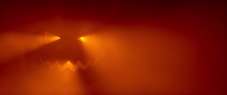 Glowing Halloween jack-o-lantern face in orange red fog with falling autumn leaves silhouettes. Spooky pumpkin glow atmospheric horror holiday background. Seamless loop 3d rendering animation.