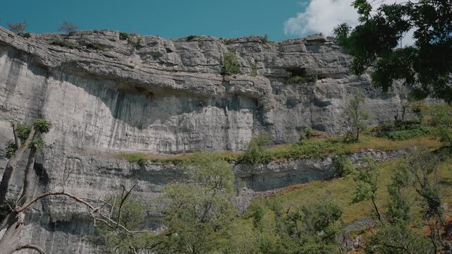 Malham Cove, a dramatic limestone cliff in Yorkshire Dales National Park, North Yorkshire, England, UK - 4 September 2026.