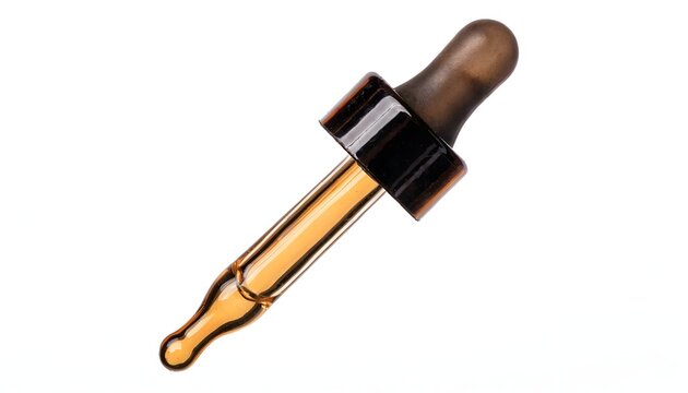 Glass dropper pipette with amber liquid and dark rubber bulb resting isolated against a bright white background.