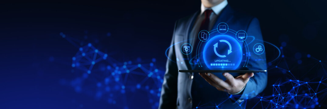 Businessman Holding Device with Update Icons on Screen. Software Updating or Upgrade Concept