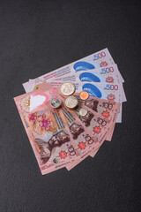 Brunei paper money, dollar banknotes and sen coins as currency for exchange or travel. Brunei money © chernikovatv