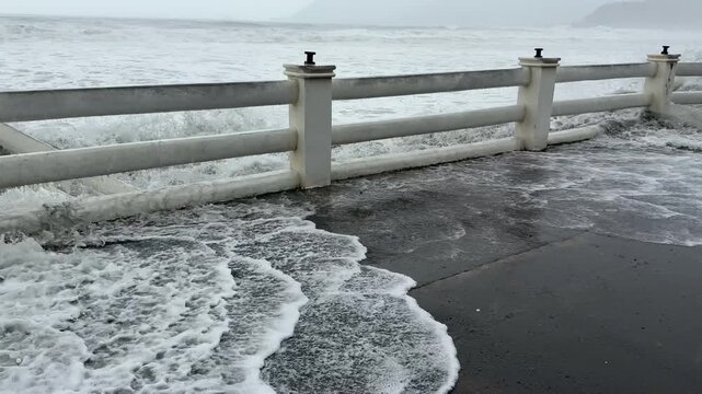 Large Storm Surge Waves Crash Ashore Soaking Waterfront