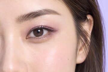 Fototapeta premium Close Up of Asian Woman Eye With Soft Pink Eyeshadow and Natural Beauty Makeup