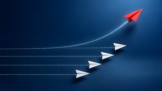 Red paper airplane changing direction from white airplanes representing business innovation and disruptive leadership strategy