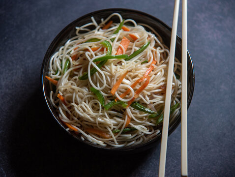 Chinese dish vegetable noodles served in a bowl. Close up, selective focus.