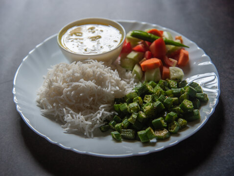 Indian veg meal with rice, dal and vegetables.