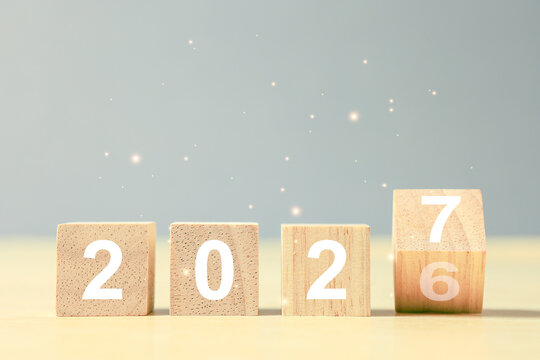 Wooden number blocks changing from 2026 to 2027 symbolize New Year transition, fresh start, annual planning, future goals, progress, change, countdown, and new opportunities ahead.