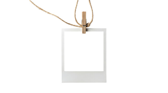 Blank instant photo frame hanging on string isolated on transparent background
