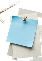 Fototapeta premium Blue sticky note pinned on paper layers.