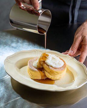 Pouring Syrup Over Japanese Souffle Pancakes
