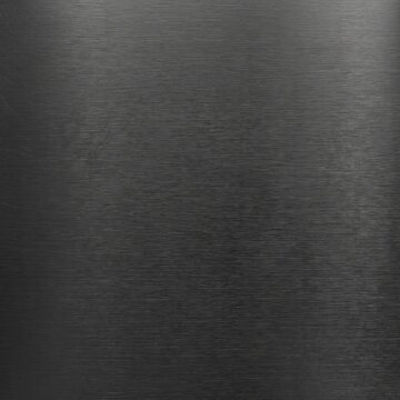 Brushed black metal texture background, dark charcoal stainless steel surface, elegant industrial matte metallic finish for luxury product design